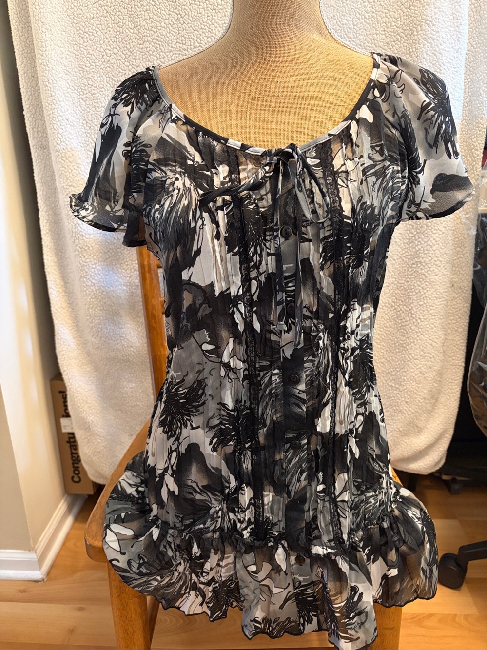 Notations black Pleated tie front button down top with ruffle at bottom. Size L